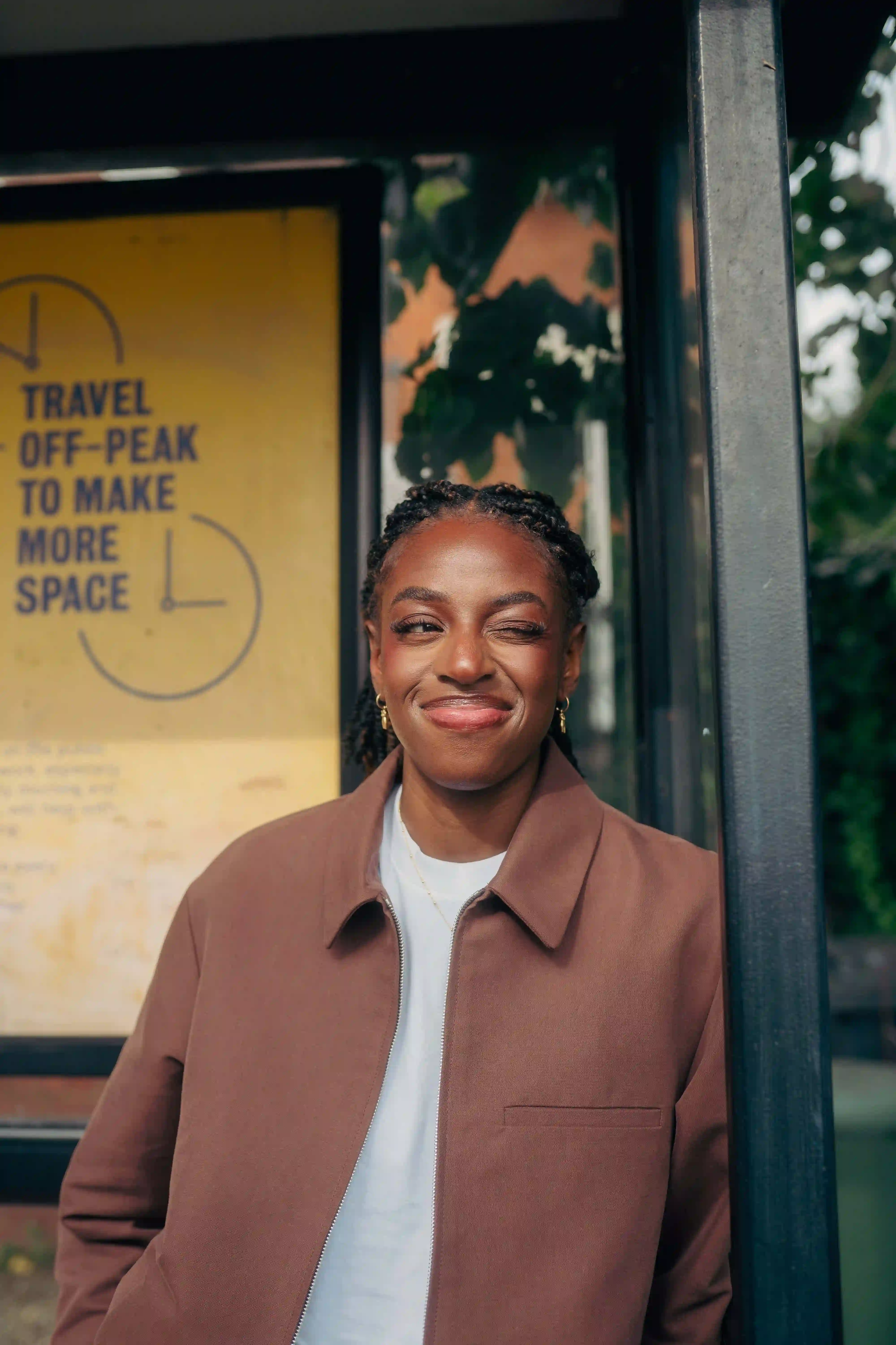 Portait of Cat Burns at a Bus Stop