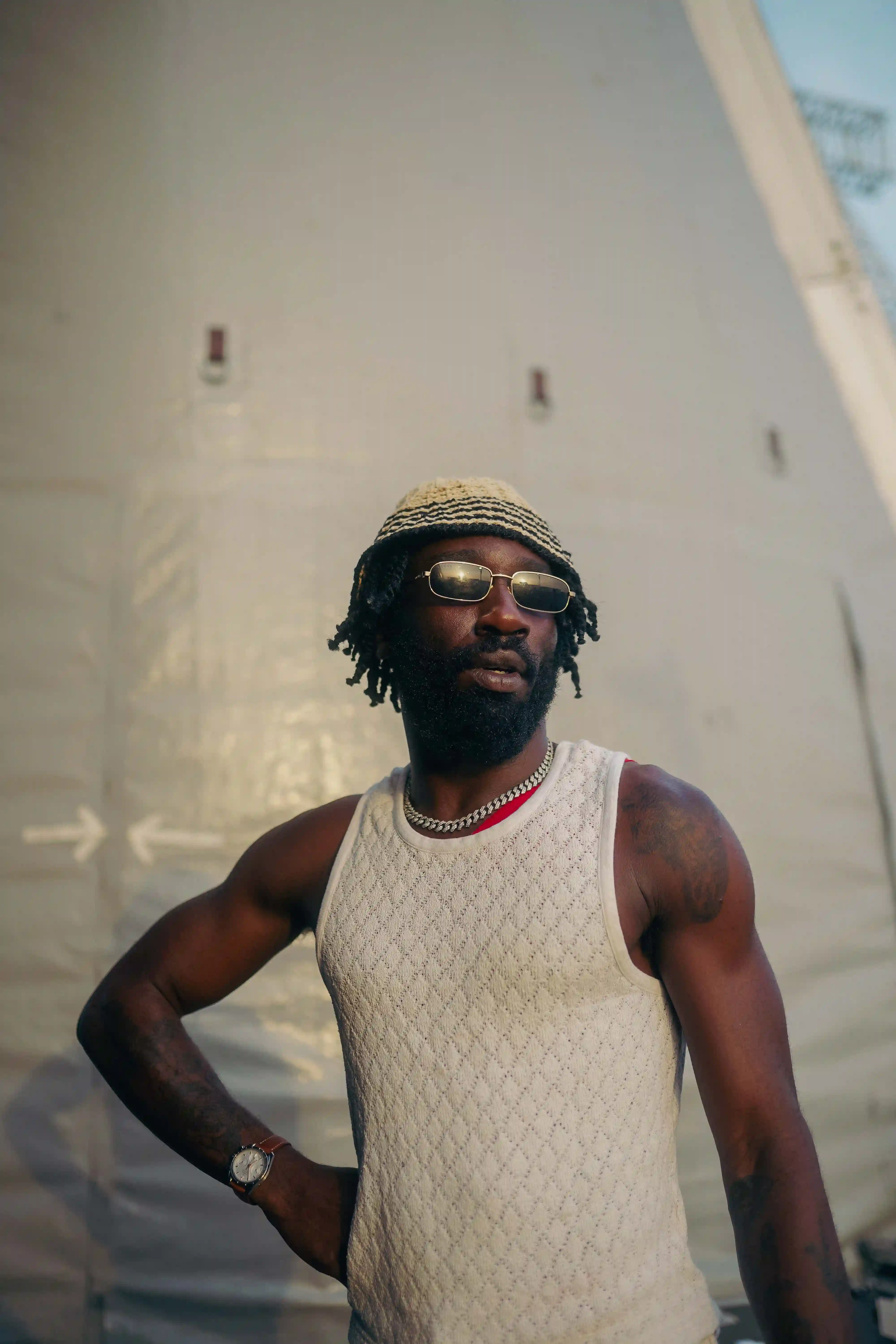 Kojey Radical in a white vest